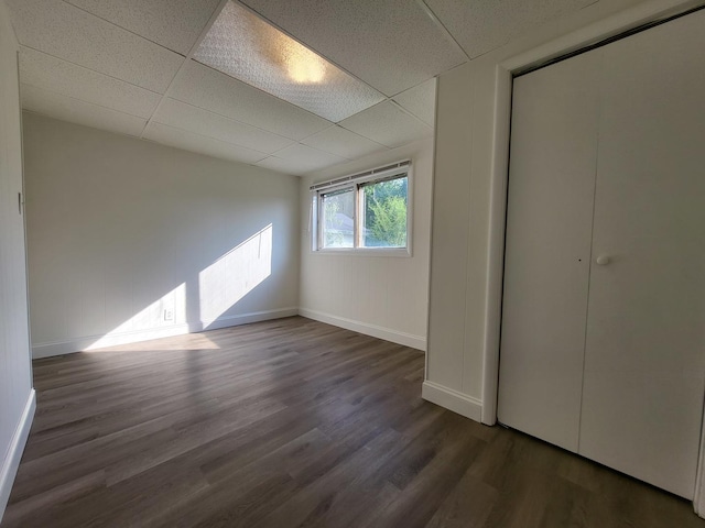 37714 N Nippersink Pl, Spring Grove, IL 60081 - unfurnished bedroom with wood finished floors, baseboards, and a drop ceiling
