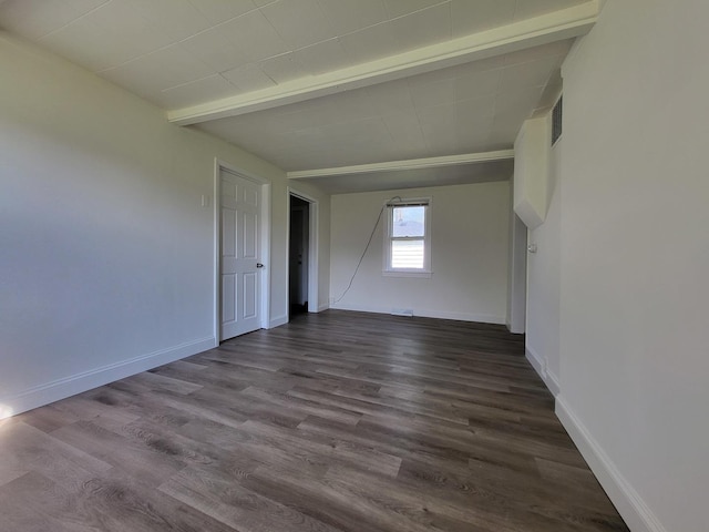 37714 N Nippersink Pl, Spring Grove, IL 60081 - spare room featuring dark wood finished floors, baseboards, and beamed ceiling