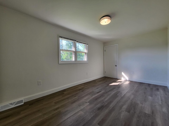 37714 N Nippersink Pl, Spring Grove, IL 60081 - empty room featuring dark wood-type flooring and baseboards