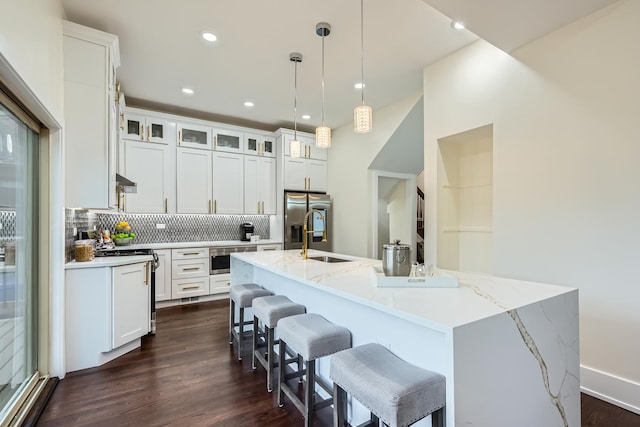 9556 S Winchester Ave, Chicago, IL 60643 - kitchen with stainless steel refrigerator with ice dispenser, tasteful backsplash, a center island with sink, dark wood-style flooring, and white cabinets