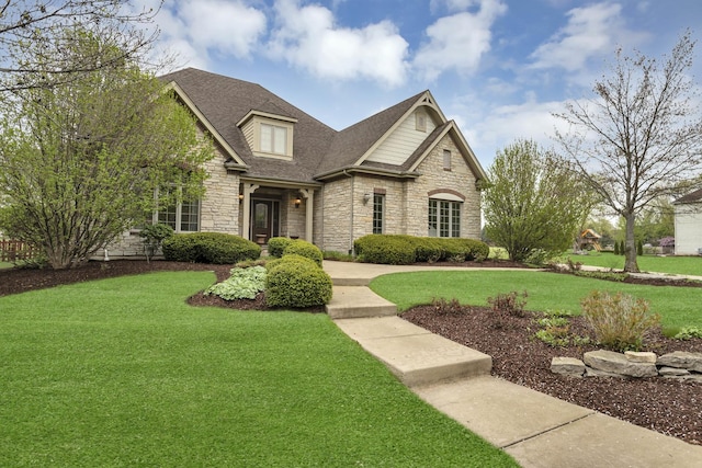 2559 Bird Ln, Batavia, IL 60510 - view of front of house featuring stone siding, a front yard, and roof with shingles