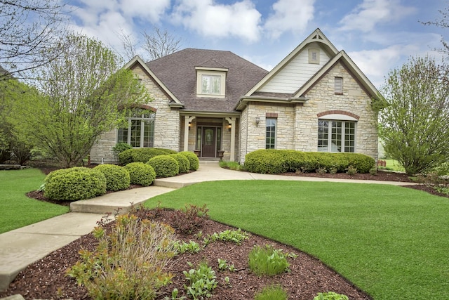2559 Bird Ln, Batavia, IL 60510 - view of front of house with stone siding, a front yard, and roof with shingles
