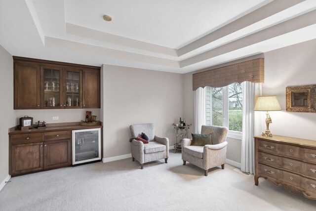 2559 Bird Ln, Batavia, IL 60510 - sitting room with wine cooler, a bar, a tray ceiling, and baseboards