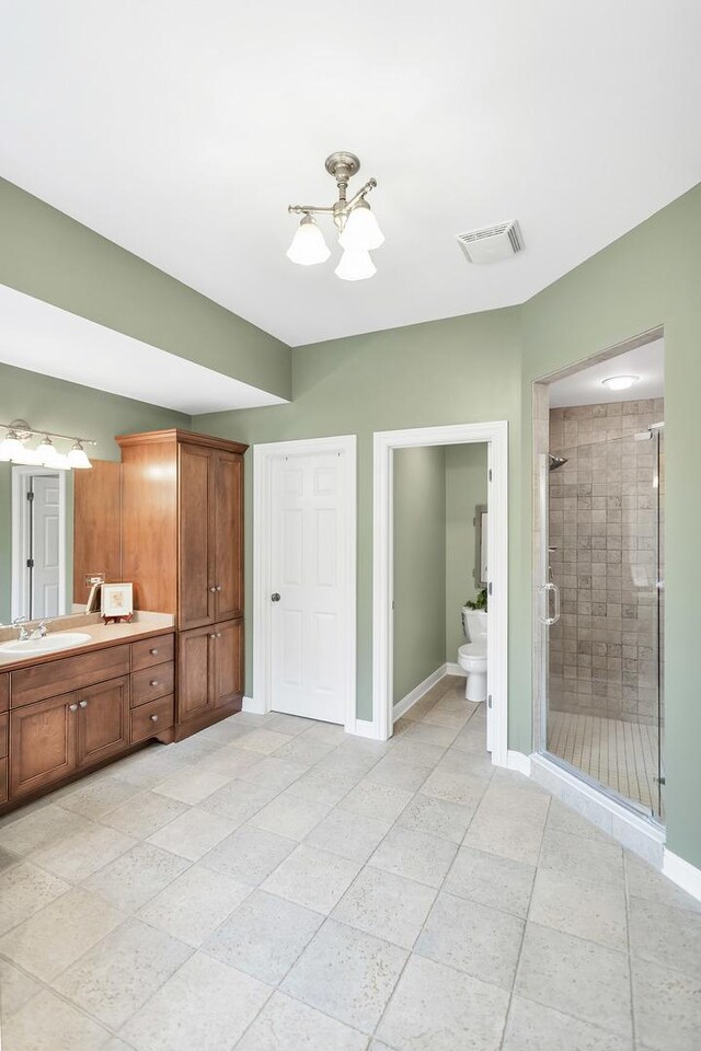 2559 Bird Ln, Batavia, IL 60510 - bathroom featuring a chandelier, vanity, a shower stall, tile patterned floors, and baseboards