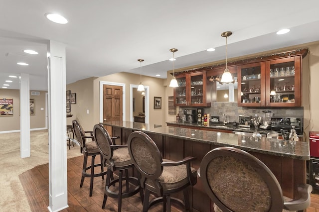 2559 Bird Ln, Batavia, IL 60510 - indoor wet bar with recessed lighting, backsplash, hanging light fixtures, and dark wood-style flooring