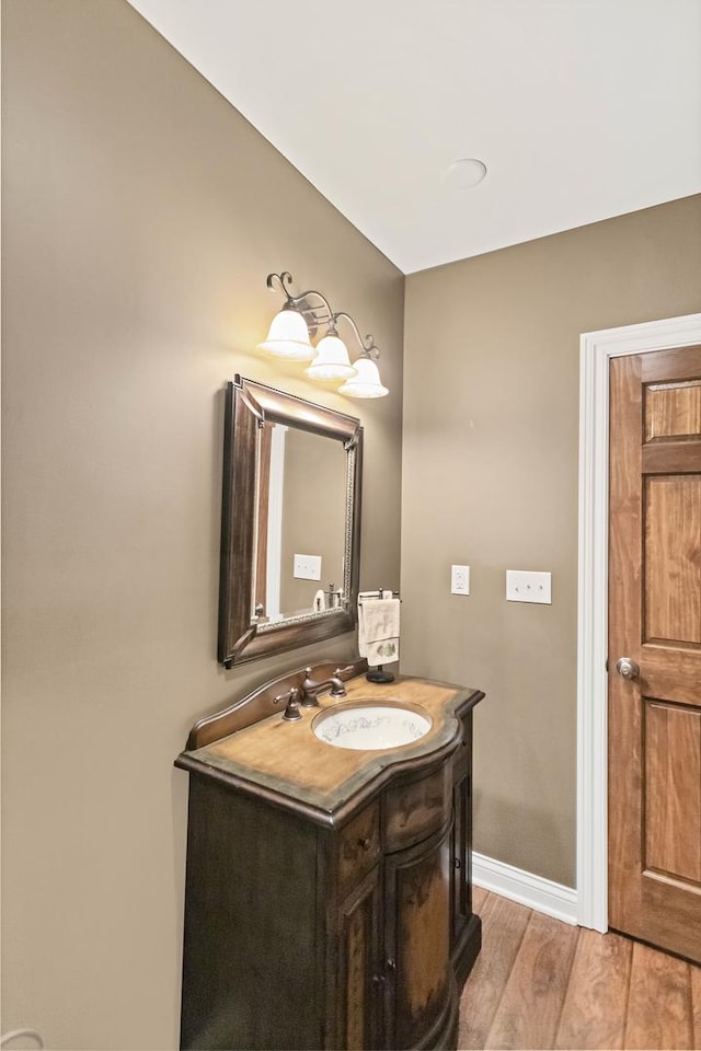 2559 Bird Ln, Batavia, IL 60510 - bathroom with vanity, wood finished floors, and baseboards