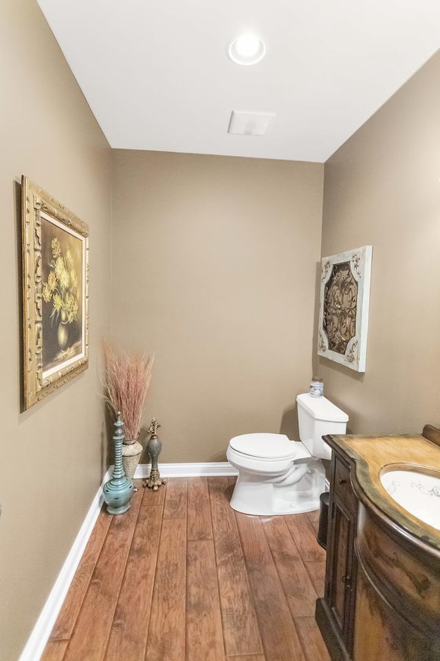 2559 Bird Ln, Batavia, IL 60510 - bathroom featuring toilet, vanity, wood finished floors, and baseboards