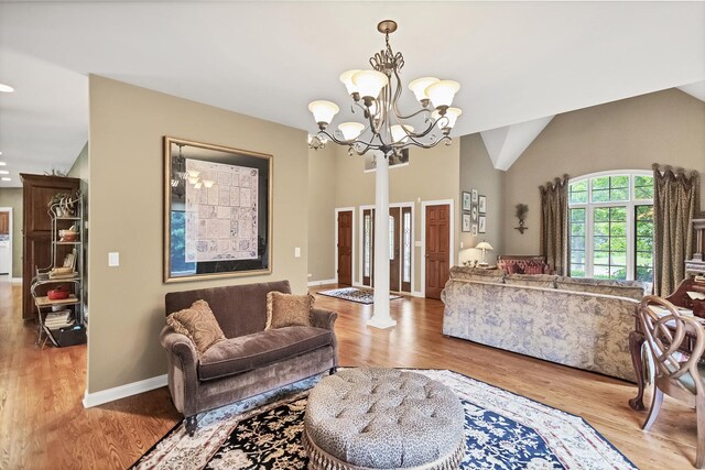 2559 Bird Ln, Batavia, IL 60510 - living area with wood finished floors, a chandelier, baseboards, and high vaulted ceiling