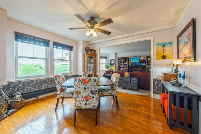 5555 N Sheridan Rd Unit 309, Chicago, IL 60640 - dining room with wood-type flooring, ornamental molding, and ceiling fan