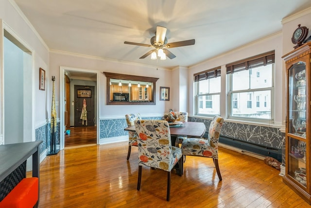 5555 N Sheridan Rd Unit 309, Chicago, IL 60640 - dining room featuring hardwood / wood-style flooring, a ceiling fan, and crown molding