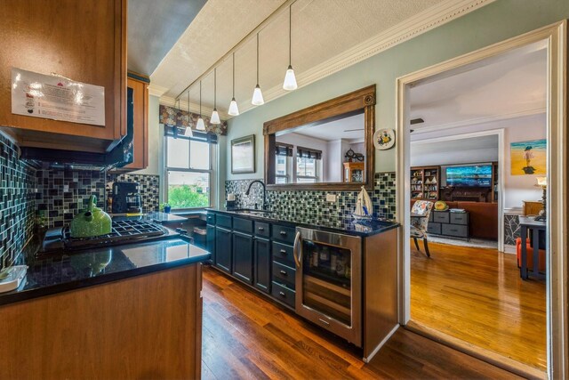 5555 N Sheridan Rd Unit 309, Chicago, IL 60640 - kitchen with beverage cooler, a sink, gas stovetop, tasteful backsplash, and dark wood-style floors