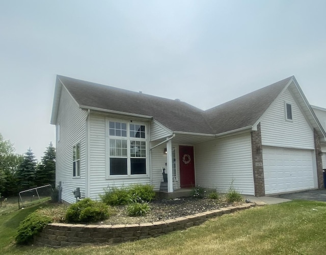 5476 Bastian Blvd, South Beloit, IL 61080 - view of front facade with a shingled roof and asphalt driveway