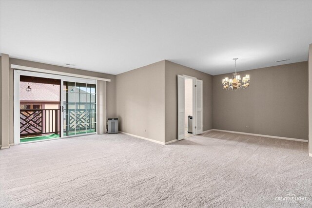 1778 Gloucester Ct Unit B, Wheaton, IL 60189 - carpeted empty room with a chandelier and baseboards