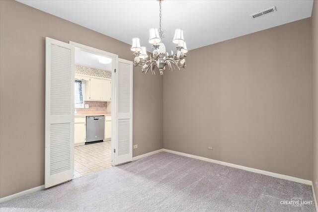 1778 Gloucester Ct Unit B, Wheaton, IL 60189 - empty room featuring a chandelier, light carpet, and baseboards