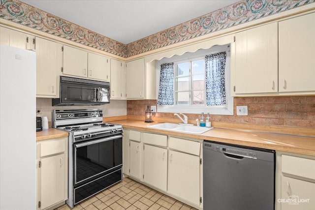 1778 Gloucester Ct Unit B, Wheaton, IL 60189 - kitchen featuring stainless steel dishwasher, gas range, black microwave, a sink, and freestanding refrigerator
