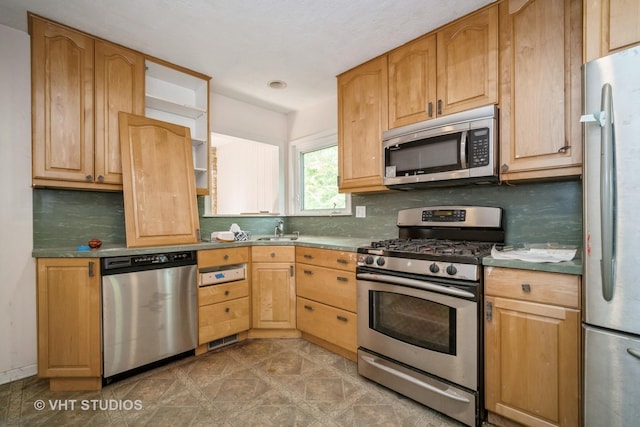 1731 Maple Ave, Northbrook, IL 60062 - kitchen featuring appliances with stainless steel finishes and tasteful backsplash