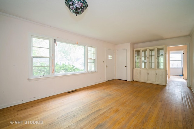 1731 Maple Ave, Northbrook, IL 60062 - unfurnished living room with wood-type flooring and baseboards