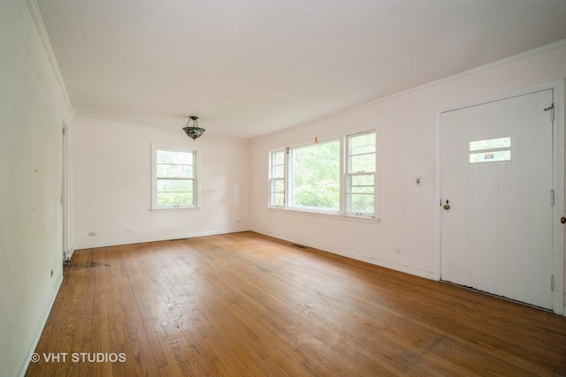 1731 Maple Ave, Northbrook, IL 60062 - entryway featuring light wood finished floors and crown molding