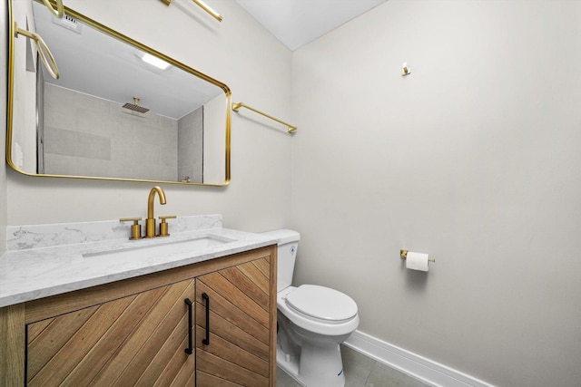 179 Glen Hill Dr, Glendale Heights, IL 60139 - bathroom with vanity, baseboards, toilet, tile patterned floors, and tiled shower