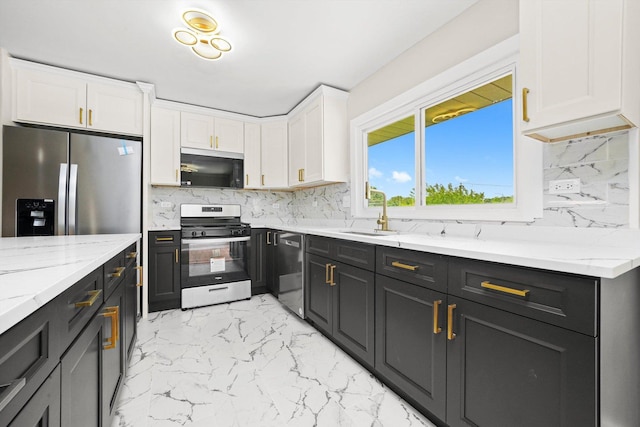 179 Glen Hill Dr, Glendale Heights, IL 60139 - kitchen with stainless steel appliances, white cabinetry, a sink, backsplash, and light marble finish flooring
