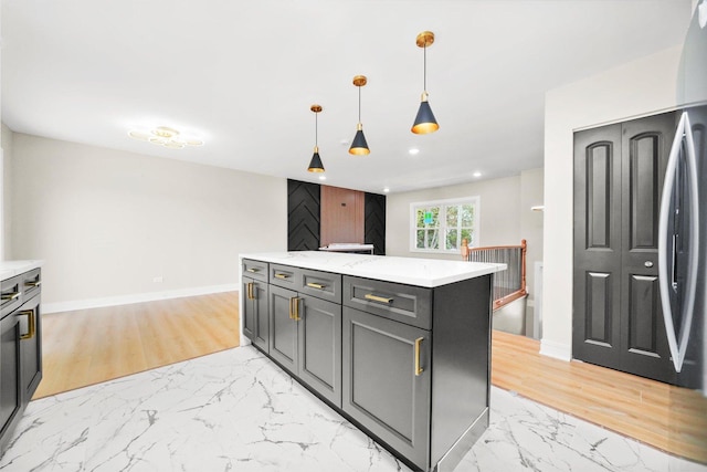 179 Glen Hill Dr, Glendale Heights, IL 60139 - kitchen featuring light marble finish floors, pendant lighting, baseboards, recessed lighting, and a kitchen island