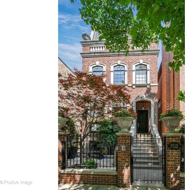 2015 N Howe St, Chicago, IL 60614 - view of front of property featuring a fenced front yard, brick siding, and a gate