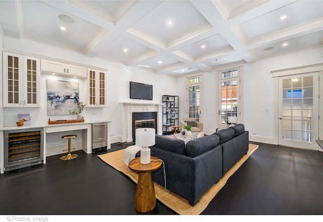 2015 N Howe St, Chicago, IL 60614 - living room featuring wine cooler, coffered ceiling, beamed ceiling, baseboards, and a glass covered fireplace
