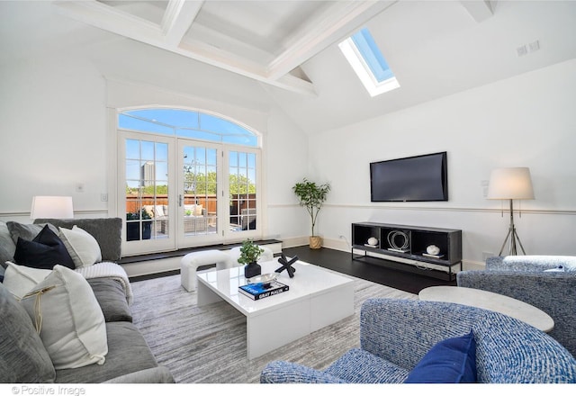 2015 N Howe St, Chicago, IL 60614 - living room featuring beamed ceiling, a skylight, high vaulted ceiling, wood finished floors, and baseboards