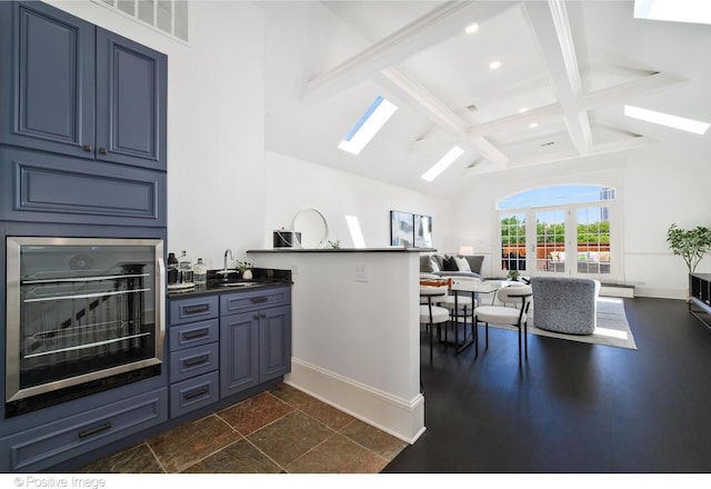 2015 N Howe St, Chicago, IL 60614 - kitchen featuring a skylight, a sink, recessed lighting, baseboards, and open floor plan