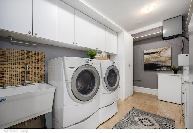 2015 N Howe St, Chicago, IL 60614 - laundry room with cabinet space, separate washer and dryer, and baseboards