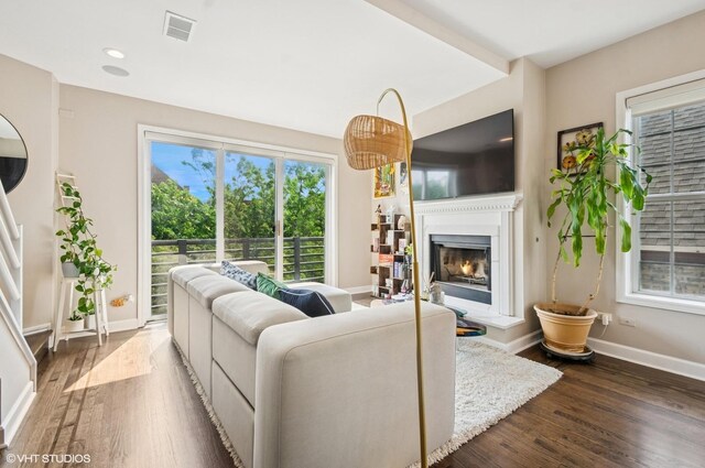 1444 N Bosworth Ave Unit 3S, Chicago, IL 60642 - living room with dark wood-type flooring, a lit fireplace, baseboards, and recessed lighting