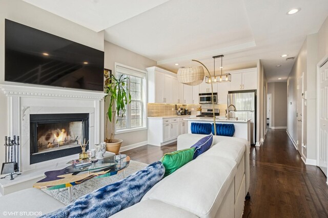 1444 N Bosworth Ave Unit 3S, Chicago, IL 60642 - living area featuring dark wood-style floors, baseboards, a fireplace, and recessed lighting