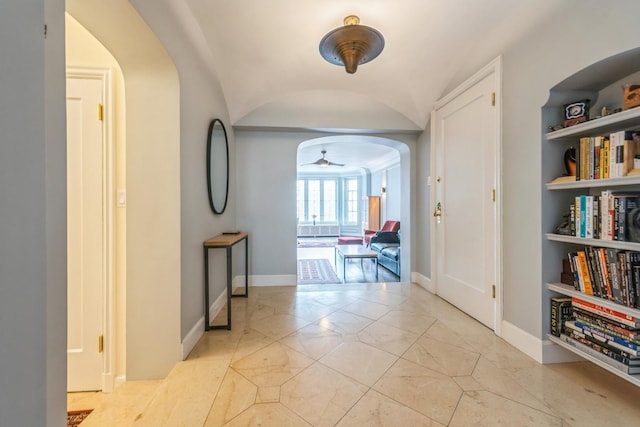 421 W Melrose St Unit 10B, Chicago, IL 60657 - hallway with arched walkways, baseboards, and vaulted ceiling