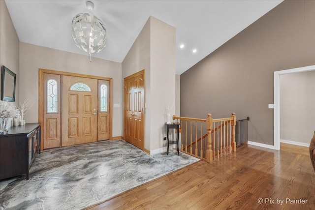 3609 Sagebrush Ct, Johnsburg, IL 60051 - entrance foyer featuring wood finished floors, baseboards, and high vaulted ceiling