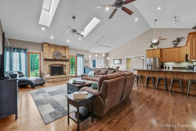 3609 Sagebrush Ct, Johnsburg, IL 60051 - living area with ceiling fan, a skylight, light wood-style floors, high vaulted ceiling, and recessed lighting