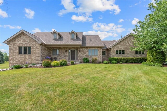 3609 Sagebrush Ct, Johnsburg, IL 60051 - view of front of property featuring a front yard, brick siding, and a shingled roof