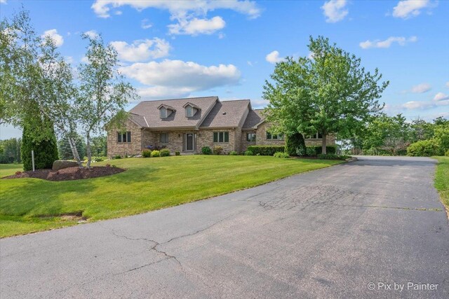 3609 Sagebrush Ct, Johnsburg, IL 60051 - view of front of home featuring a front lawn and brick siding