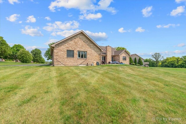 3609 Sagebrush Ct, Johnsburg, IL 60051 - back of house with brick siding and a lawn
