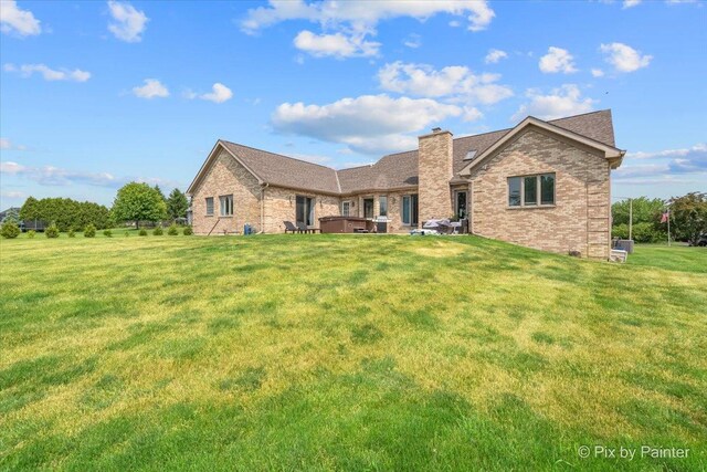 3609 Sagebrush Ct, Johnsburg, IL 60051 - view of front of property with brick siding, a front lawn, and a chimney