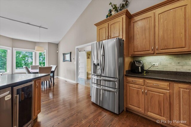 3609 Sagebrush Ct, Johnsburg, IL 60051 - kitchen with stainless steel refrigerator with ice dispenser, beverage cooler, backsplash, dark wood-style flooring, and high vaulted ceiling