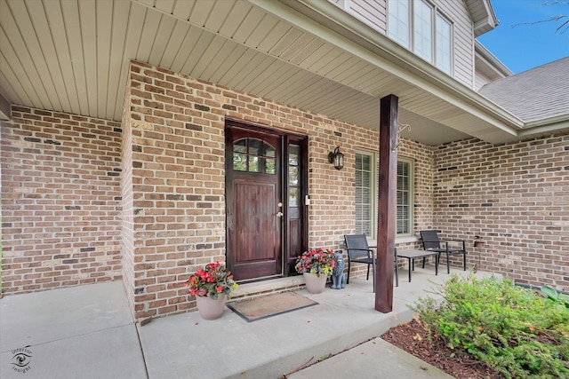 942 Meadowbrook Rd, Elwood, IL 60421 - view of exterior entry with brick siding and a porch