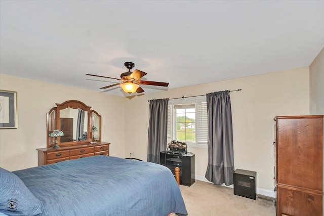 942 Meadowbrook Rd, Elwood, IL 60421 - bedroom featuring light carpet, ceiling fan, and baseboards