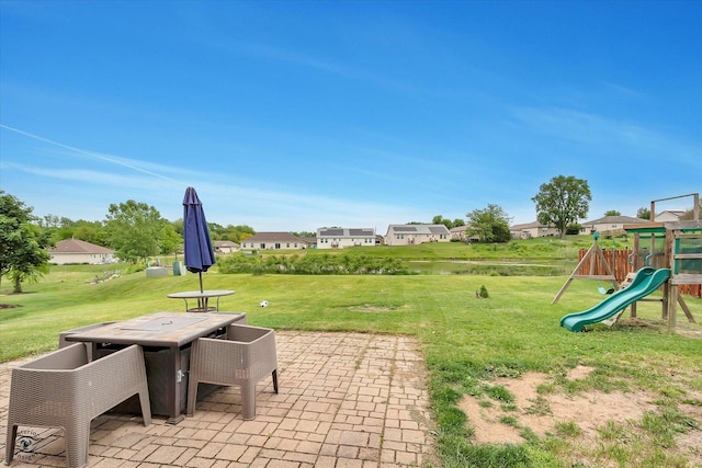 942 Meadowbrook Rd, Elwood, IL 60421 - view of patio / terrace featuring a playground and outdoor dining space
