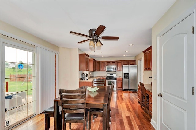 942 Meadowbrook Rd, Elwood, IL 60421 - dining space featuring light wood-style flooring, a ceiling fan, and recessed lighting
