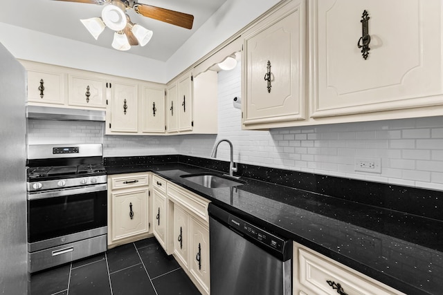 4829 W 109th St Unit 301, Oak Lawn, IL 60453 - kitchen with stainless steel appliances, a sink, under cabinet range hood, dark tile patterned flooring, and ceiling fan