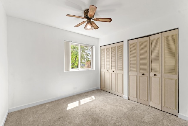 4829 W 109th St Unit 301, Oak Lawn, IL 60453 - unfurnished bedroom featuring multiple closets, carpet, baseboards, and ceiling fan