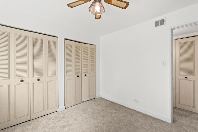4829 W 109th St Unit 301, Oak Lawn, IL 60453 - unfurnished bedroom with carpet, multiple closets, baseboards, and ceiling fan