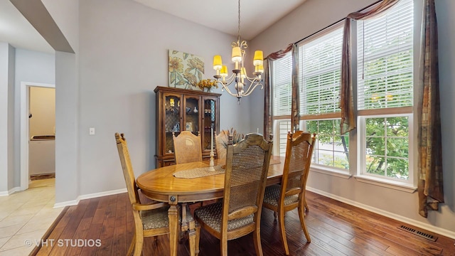 2217 Tyler Trl, Mchenry, IL 60051 - dining room featuring a chandelier, baseboards, plenty of natural light, and wood-type flooring