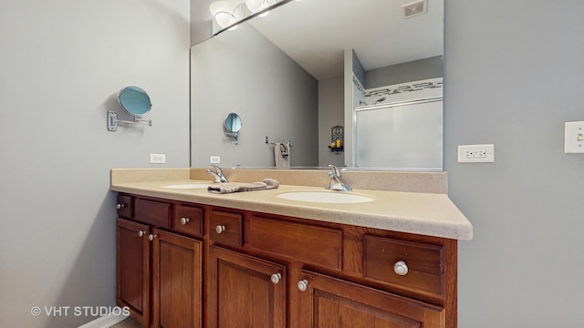 2217 Tyler Trl, Mchenry, IL 60051 - bathroom featuring double vanity and a shower with shower door