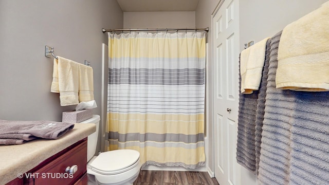 2217 Tyler Trl, Mchenry, IL 60051 - full bathroom featuring toilet, wood finished floors, a shower with curtain, and vanity